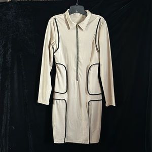 Tan form fitting black piping dress.